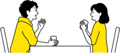 テーブルに向き合いお茶を飲む夫婦